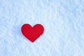 Greeting card with lonely heart on the dazzling blue snow