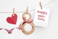 Greeting card for March 8. eight kraft paper hangs on a thread with clothespins and a palaroid photo on a white Royalty Free Stock Photo