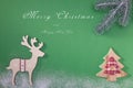 Greeting card with a Merry Christmas tree and snow, a symbol of the holiday, family togetherness. Happy New Year. Royalty Free Stock Photo