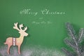 Greeting card with a Merry Christmas tree and snow, a symbol of the holiday, family togetherness. Happy New Year. Royalty Free Stock Photo