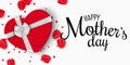 Greeting card for Mothers Day. Red gift box of heart with bow. White background. Rose petals and confetti. I love mommy. Calligrap