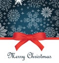 Greeting card with red bow on snowflakes background and copy space Royalty Free Stock Photo