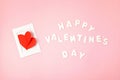 Greeting card with red paper hearts and text Happy valentines day over pink background. Love, saint valentines day concept Royalty Free Stock Photo