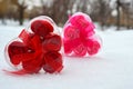 Two hearts. red and pink heart in the snow