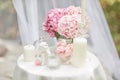 Greeting card in shabby chic style. hydrangea flowers, angel figurine, marshmallows, candles on the table Royalty Free Stock Photo