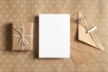 Greeting card stationary mockup with envelope and gift box on craft paper background Royalty Free Stock Photo