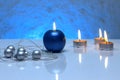 Greeting card template made of blue and tea candles, silver christmas balls, silver string of beads and blue ribbon in front Royalty Free Stock Photo