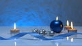 Greeting card template made of blue and tea candles, silver christmas balls, silver string of beads and blue ribbon in front Royalty Free Stock Photo