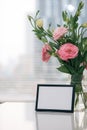 A greeting card template with a place for text, a photo of a blank frame in a bouquet of lisianthus flowers