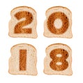 2018 greeting card on toasted slices of bread isolated on white