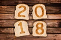 2018 greeting card toasted slices of bread on wooden planks