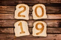 2019 greeting card toasted slices of bread on wooden planks