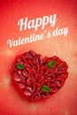 Greeting card with Valentine`s Day. confectionery Raspberry tart with mint in the form of a heart, lies on a red background Royalty Free Stock Photo