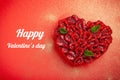 Greeting card with Valentine`s Day. confectionery Raspberry tart with mint in the form of a heart, lies on a red background Royalty Free Stock Photo