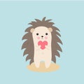 Greeting card Valentine`s day. Cute hedgehog with a pink heart in paws. Royalty Free Stock Photo