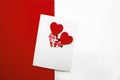 Greeting card for Valentinen`s Day with wooden red hearts