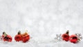 Greeting Christmas decorations red toys balls on the snow sparkling silver background banner with copy space Royalty Free Stock Photo