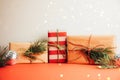 Greeting Christmas, new year& x27;s background. Gifts wrapping in brown and red paper on a red background Royalty Free Stock Photo