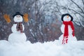 Greeting snowman. Happy smiling snow man on sunny winter day. Merry Christmas and Happy new year. Two Snowman on snow Royalty Free Stock Photo