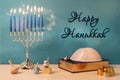 greetings with jewish religious holiday hanukkah with wooden spinning top toy & x28;dreidel& x29; and chocolate coins Royalty Free Stock Photo