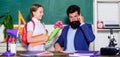 Greetings for school pedagogue. Girl adorable pupil with backpack giving bouquet flowers teacher. Knowledge day