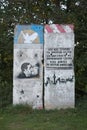 GREIFSWALD, GERMANY - OCTOBER 10 2015: A part of the former Berlin Wall with historic graffiti paintings. The left painting depict