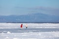 People ice skating on frozen lake Baikal