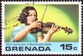 GRENADA - CIRCA 1978: A stamp printed in Grenada shows woman violinist, circa 1978.