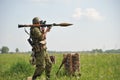 A grenade launcher warrior at the shooting range is preparing to fire a shot