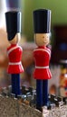 Grenadier guards wearing black hats and red jacket
