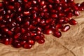 Grenadine seeds on rustic paper Royalty Free Stock Photo