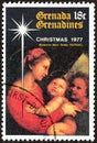 GRENADINES OF GRENADA - CIRCA 1977: A stamp printed in Grenada  shows Madonna della Tenda Raphael, circa 1977. Royalty Free Stock Photo