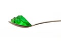 Grenn jello on teaspoon Royalty Free Stock Photo