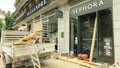 GRENOBLE, FRANCE - JULY 1, 2023. Workers fix broken storefronts of Sephora after night riots in city centre