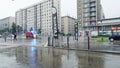 GRENOBLE, FRANCE - JUNE 25, 2023. Emergency vehicle with strobe lights and siren speeding along wet street