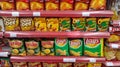 GRESIK, INDONESIA - 13 October 2021: Various snacks and flavored chips on supermarket shelfs.
