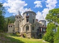 Gressoney, Italy. View of the left side of Castel Savoia immersed in the woods. Royalty Free Stock Photo