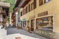 Gressoney-Saint-Jean, Italy. View of Via Monte Rosa in the town center, with shops and people on the street.