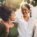 We grew up together. two cheerful young friends standing together while laughing all the way outside during the day. Royalty Free Stock Photo