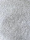 Grey abstract background with fur pile. Fur cloth. Gray fluffy textile surface, fur fabric. Abstract fabric background