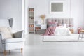 Grey armchair in cozy bedroom Royalty Free Stock Photo