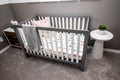 Grey Baby Crib Bed With White Slats Royalty Free Stock Photo