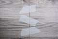 Grey background of broken plywood board with texture sealed with tape Royalty Free Stock Photo