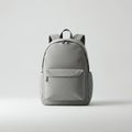 A grey backpack with a minimalist design. It features a large front pocket, two side Royalty Free Stock Photo