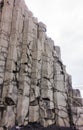 Grey basalt columns near Reynisdrangar beach, Iceland .