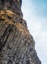 Grey basalt columns near Reynisdrangar beach, Iceland .