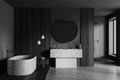 Grey bathroom interior with sink, tub and douche, accessories and window