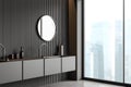 Grey bathroom interior with washbasin, accessories on deck and panoramic window