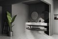 Grey bathroom interior with washbasins and mirror, accessories. Mockup wall