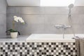 Grey bathroom with mosaic tiles